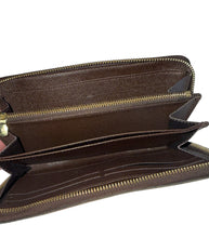 Louis Vuitton zippy wallet in Damier Ebene leather